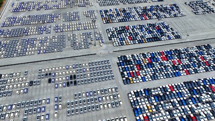 A symphony of automotive efficiency unfolds below, as cars dot the landscape in perfect harmony. This aerial vista encapsulates the systematic essence of the automotive domain.
