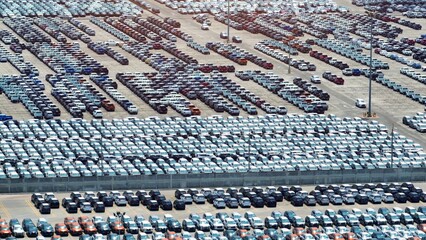 From above, witness the choreography of vehicles in this sprawling parking lot, a testament to...