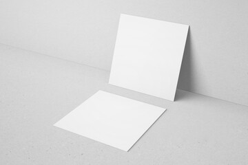 blank white square shape ratio branding identity business name card with sharp corner leaning to wall realistic mockup design template 3d render illustration
