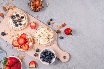 Rice Crackers Healthy Snack, Crackers Topped with Banana, Fresh Berries, Yogurt and Granola, Breakfast Idea