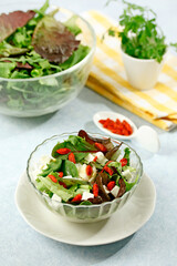 Fresh salad with cheese and berries.