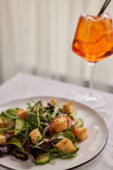 fresh salad with cubes of croutons, vertical photo of salad