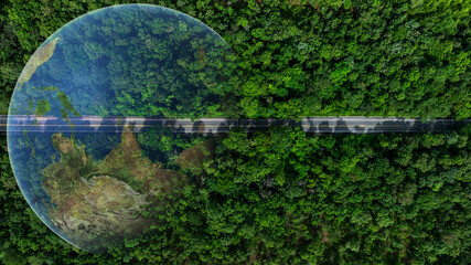 Aerial top view asphalt road forest in tropical rainforest with globe planet earth, Green forest with earth, Green planet in your hands, Save Earth, Ecosystem and healthy environment.