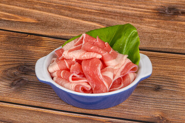 Sliced pork bacon in the bowl