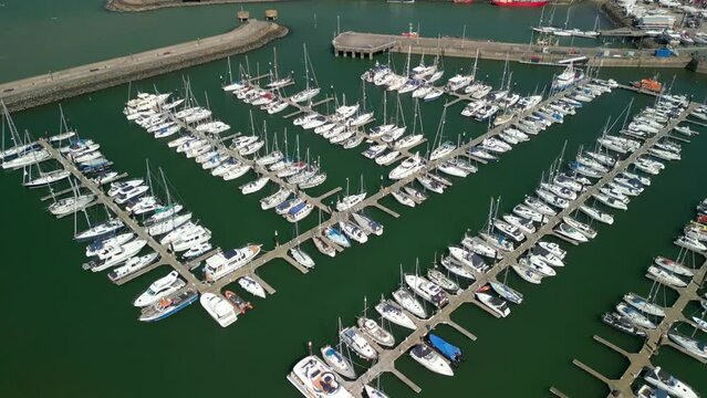 Overhead aerial shot, pushing forwards and overhead, revealing boats on a marina on a sunny day.

Filmed at Bangor Marina, Northern Ireland in 4K, 60 frames per second and with Rec709 color space.