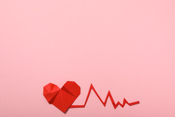 Heart with a cardiogram on a light background.