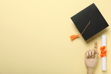Graduate hat and diploma on yellow background.