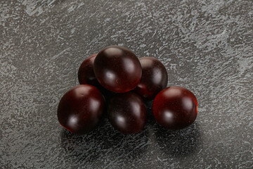 Raw ripe black kumato tomato