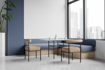 Obraz premium Cozy restaurant interior with chairs and sofa near panoramic window