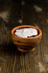 fresh creamy yogurt with berries and blueberry jam