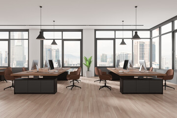 Fototapeta premium Stylish coworking interior with pc computers on desks in row, panoramic window