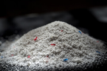 Pile of laundry detergent powder close up