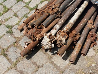 A stack of rusty scaffolding pipes.