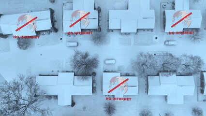 Top-down of snow-covered houses with NO INTERNET signs. Power and internet outage in American...
