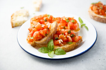 Traditional tomato bruschetta with greens