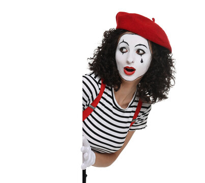 Funny mime with blank poster posing on white background