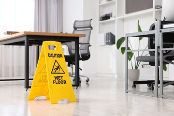 Cleaning service. Wet floor sign in office, space for text
