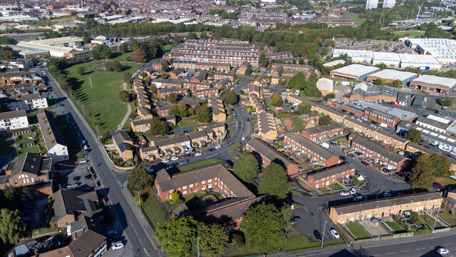 Aerial photo of the village of the town of Hunslet in Leeds West Yorkshire in the UK, showing roads and rows of residential houses, taken in the summer time.