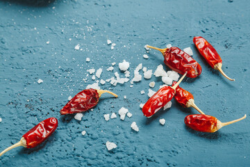 Dry chili pepper with salt as a symbol of additional species that can harm your health. Unhealthy...