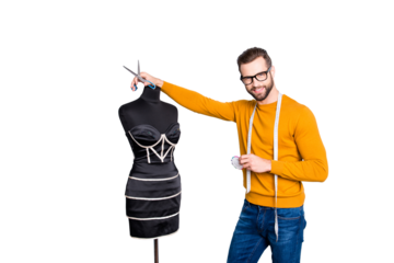 Portrait of  famous, attractive dressmaker with centimeter on neck in pullover and jeans holding scissors and needles in hands, looking at camera isolated on grey background