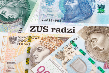 ZUS - Polish Social Insurance Institution - on the background of the Polish Zloty