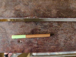 a forte cigarette on a wooden table