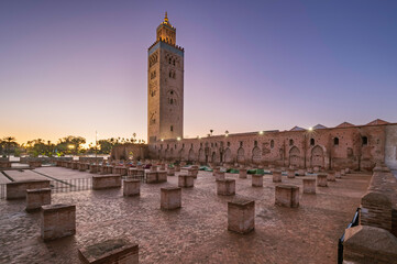12th century Koutoubia Mosque at sunrise, Marrakesh, Morocco. Outside the Mosque are ruins of the original mosque