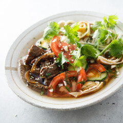 Traditional Korean soup with noodles and beef