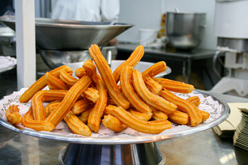 Hot churros. Fair stand to sell typical Spanish churros..