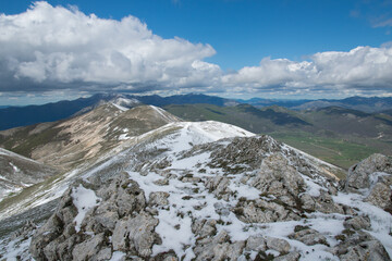 Mountain ridges view from the peak of Monte Calvo in Abruzzo during spring day of april, Italy