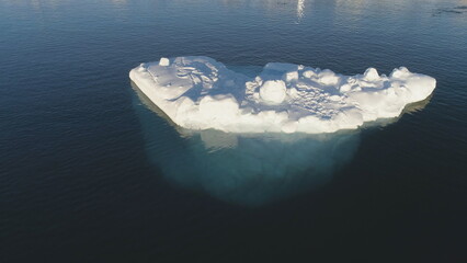 Close-up Iceberg Floating In Antarctic Ocean. Aerial Flight Over Snow-White Ice in Antarctica South...