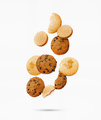 Flying assortment of various cookies on a white isolated background