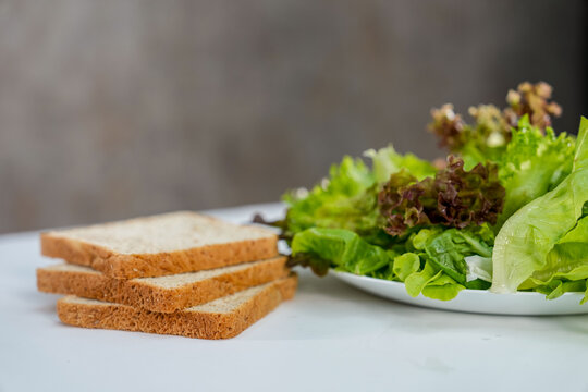 vegetable salad and whole wheat breads on the table