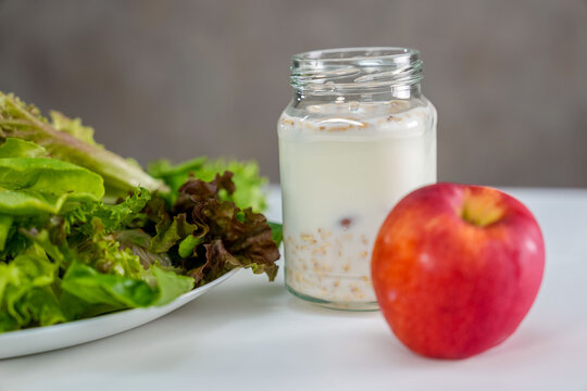 vegetable salad, granola yogurt, red apple