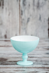 Single Turquoise Ice Cream Bowl on a White Wooden Background, Aesthetic Summer Serveware