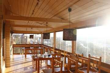 Cafe-teahouse. Wooden interior with panoramic windows