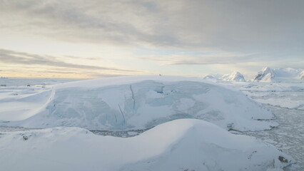 Antarctica Snow Hill Aerial Drone View. Climate Change. Antarctic Continent Expedition at Ocean Coastline. Polar Landscape. Global Warming and Melting Ice Concept. Top Flight