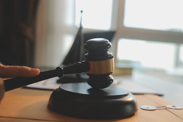 Business and lawyers discussing contract papers with brass scale on desk in office. Law, legal...