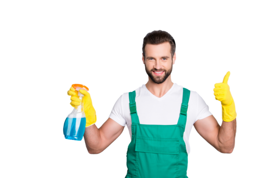 Portrait of cheerful joyful cleaner in uniform overall with stubble holding equipment in hand showing thumbup yes done recommend sign with finger isolated on grey background