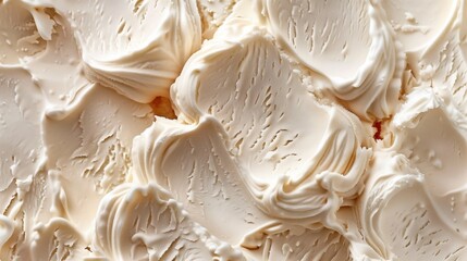 Close-up image showcasing the rich texture of creamy whipped cream or frosting.