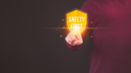Person touching the safety banner symbol, highlighting a commitment to workplace safety, zero...