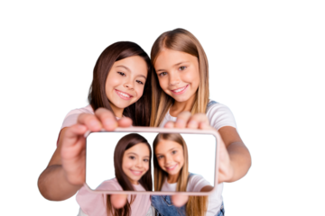 Close up photo two little she her blond brunette girls long pretty hair telephone make take selfies talk tell speak millennials wearing casual jeans denim t-shirts isolated blue bright background