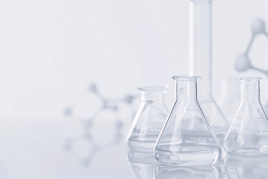 Laboratory glassware on a white background with soft shadows
