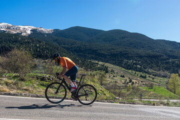 Man cycling on a steep road.