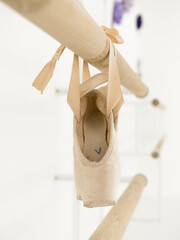 Ballerina gracefully poised at the ballet barre in a sunlit studio, practicing her pirouettes and perfecting her form amidst the serene ambiance of the dance sanctuary © Alena