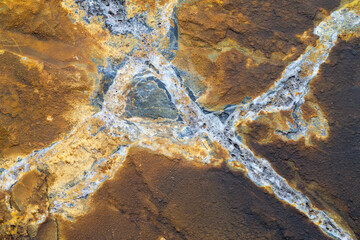 A macro shot of a rock at a close distance. Showing extreme detail and minerals that are in the rock.