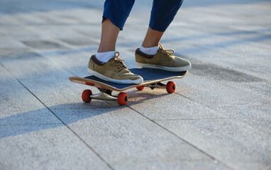 Skateboarder skateboarding outdoors in sunshine