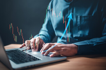 broker, chart, diagram, graph, invest, investor, management, statistic, risk, analyzing. A man is typing on a laptop with a graph of a stock market on the screen. indicating a positive trend.