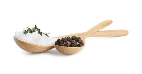 Salt with fresh thyme and peppercorns in wooden spoons isolated on white