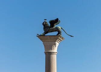A sculpture of Chimera placed on a tall column located in Piazzetta San Marco in Venice. Italy